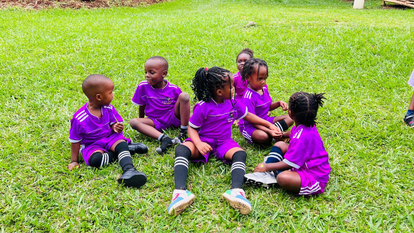 Children lined up together before soccer practice